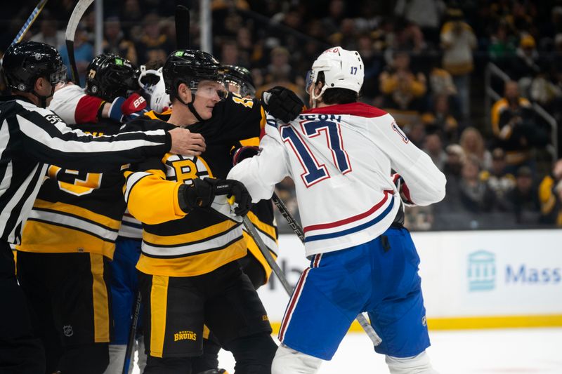 Dec 1, 2024; Boston, Massachusetts, USA; Boston Bruins center Trent Frederic (11) is pulled away from Montreal Canadiens right wing Josh Anderson (17) during the second period of a game at the TD Garden. Mandatory Credit: Natalie Reid-Imagn Images