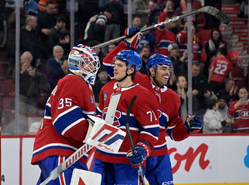 Nov 18, 2024; Montreal, Quebec, CAN;  Montreal Canadiens goalie Sam Montembeault (35) celebrates with teammates forward Jake Evans (71) and defenseman Jayden Struble (47) the win against the Edmonton Oilers at the Bell Centre. Mandatory Credit: Eric Bolte-Imagn Images