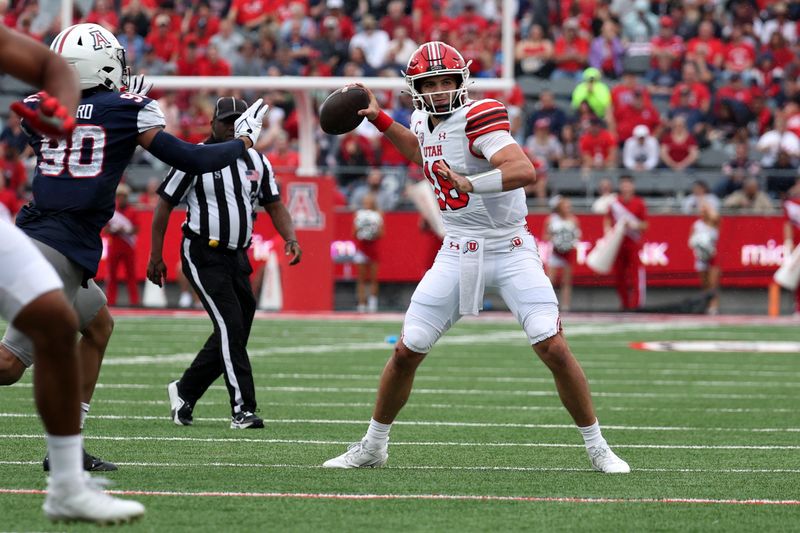 Nov 18, 2023; Tucson, Arizona, USA; Utah Utes quarterback Bryson Barnes (16) throws a pass against Arizona Wildcats defensive lineman Isaiah Ward (90) during the first half at Arizona Stadium. Mandatory Credit: Zachary BonDurant-USA TODAY Sports