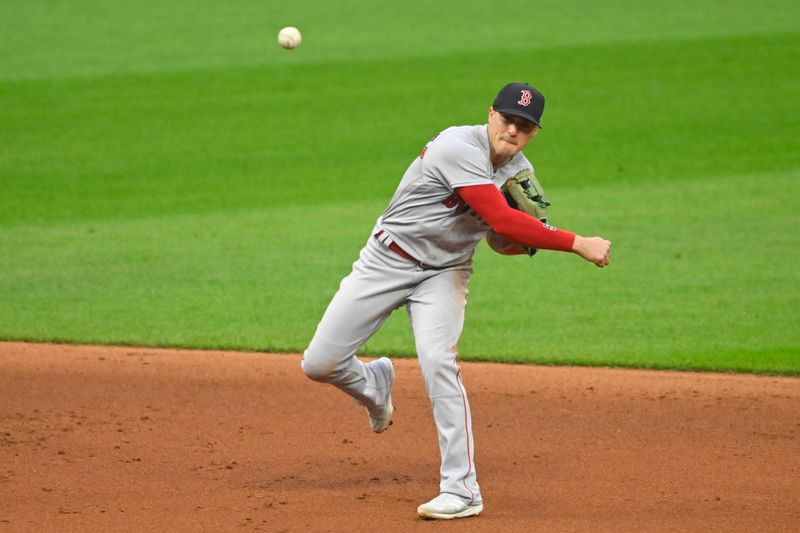 Jun 8, 2023; Cleveland, Ohio, USA; Boston Red Sox shortstop Enrique Hernandez (5) throws to first base in the fourth inning against the Cleveland Guardians at Progressive Field. Mandatory Credit: David Richard-USA TODAY Sports