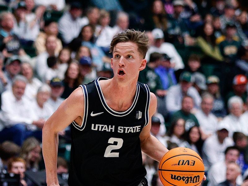 Feb 4, 2023; Fort Collins, Colorado, USA; Utah State Aggies guard Sean Bairstow (2) drives to the net in the first half against the Colorado State Rams at Moby Arena. Mandatory Credit: Isaiah J. Downing-USA TODAY Sports