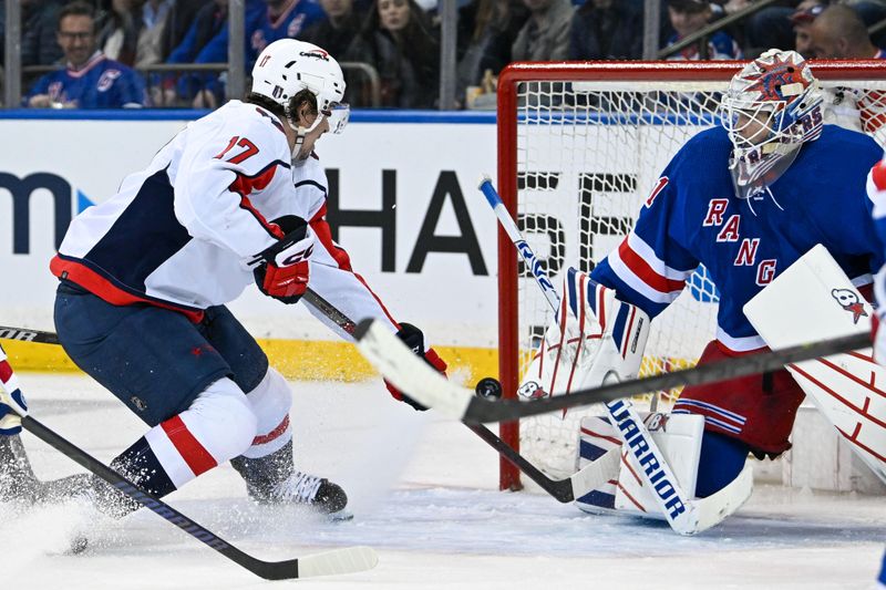 Apr 23, 2024; New York, New York, USA;  Washington Capitals center Dylan Strome (17) scores a goal past New York Rangers goaltender Igor Shesterkin (31) during the second period in game two of the first round of the 2024 Stanley Cup Playoffs at Madison Square Garden. Mandatory Credit: Dennis Schneidler-USA TODAY Sports