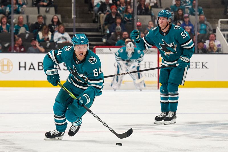 Oct 20, 2024; San Jose, California, USA; San Jose Sharks center Mikael Granlund (64) skates with the puck against the Colorado Avalanche during the second period at SAP Center at San Jose. Mandatory Credit: Robert Edwards-Imagn Images