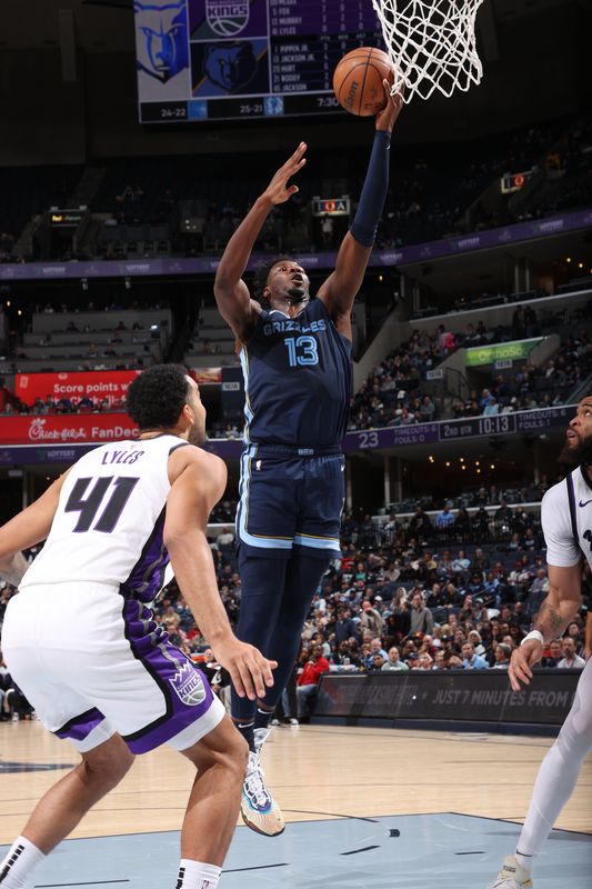 MEMPHIS, TN - JANUARY 29:  Jaren Jackson Jr. #13 of the Memphis Grizzlies drives to the basket during the game against the Sacramento Kings on January 29, 2024 at FedExForum in Memphis, Tennessee. NOTE TO USER: User expressly acknowledges and agrees that, by downloading and or using this photograph, User is consenting to the terms and conditions of the Getty Images License Agreement. Mandatory Copyright Notice: Copyright 2024 NBAE (Photo by Joe Murphy/NBAE via Getty Images)