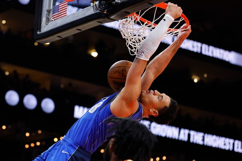 ATLANTA, GEORGIA - JANUARY 26: Josh Green #8 of the Dallas Mavericks dunks during the first quarter against the Atlanta Hawks at State Farm Arena on January 26, 2024 in Atlanta, Georgia. NOTE TO USER: User expressly acknowledges and agrees that, by downloading and or using this photograph, User is consenting to the terms and conditions of the Getty Images License Agreement. (Photo by Todd Kirkland/Getty Images)