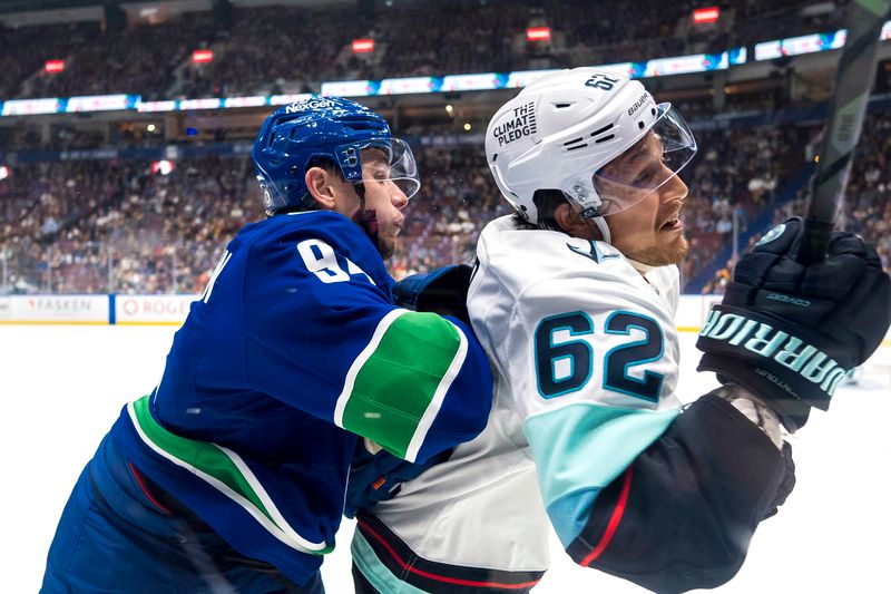 Sep 24, 2024; Vancouver, British Columbia, CAN; Vancouver Canucks forward Linus Karlsson (94) checks Seattle Kraken defenseman Brandon Montour (62) during the first period at Rogers Arena. Mandatory Credit: Bob Frid-Imagn Images