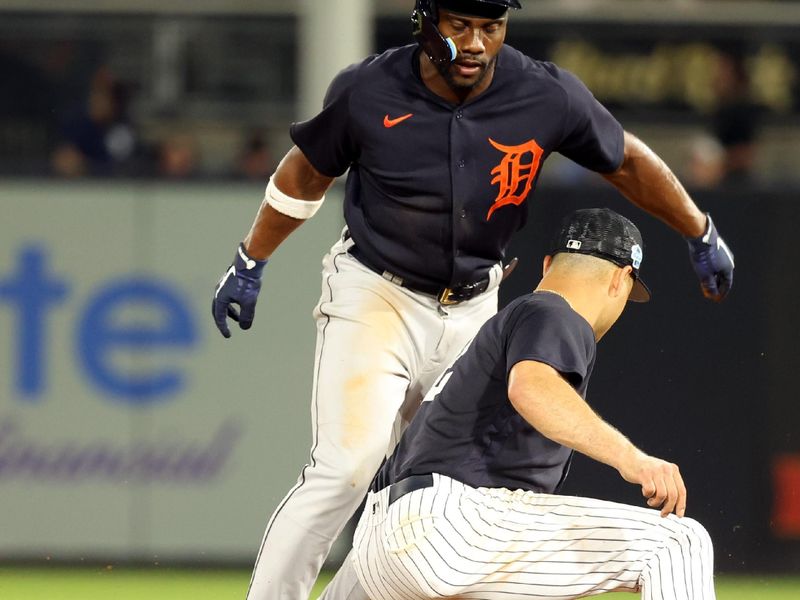 Feb 27, 2023; Tampa, Florida, USA; Detroit Tigers left fielder Akil Baddoo (60) slides safe into second base as New York Yankees shortstop Isiah Kiner-Falefa (12) attempted to tag him out during the third inning at George M. Steinbrenner Field. Mandatory Credit: Kim Klement-USA TODAY Sports