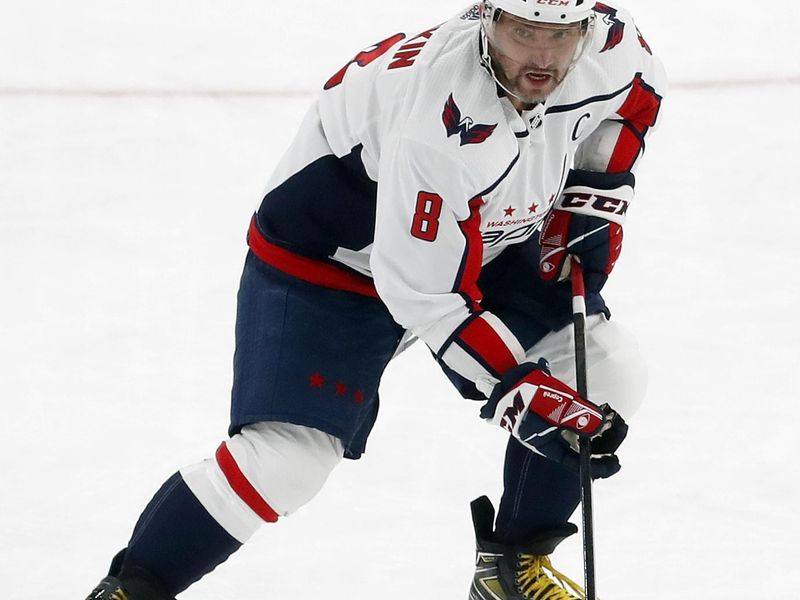 Jan 2, 2024; Pittsburgh, Pennsylvania, USA;  Washington Capitals left wing Alex Ovechkin (8) skates up ice with the puck against the Pittsburgh Penguins during the third period at PPG Paints Arena. Mandatory Credit: Charles LeClaire-USA TODAY Sports