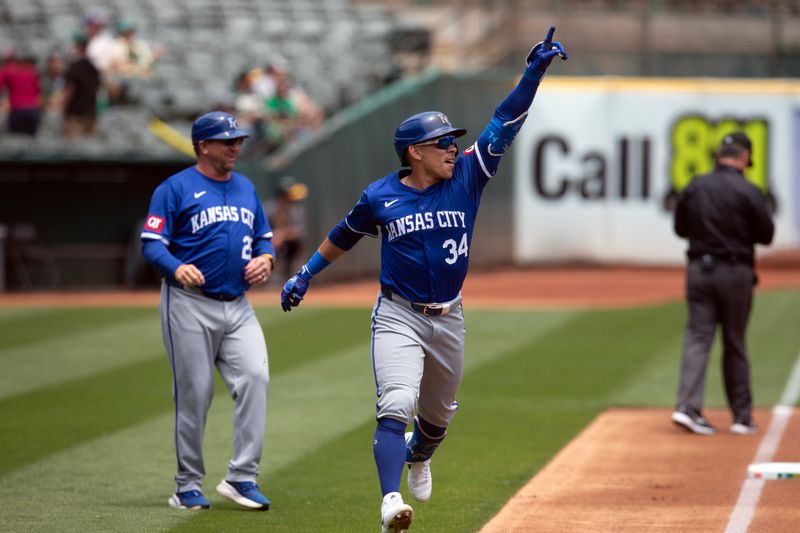 Jun 20, 2024; Oakland, California, USA; Kansas City Royals designated hitter Freddy Fermin (34) celebrates his solo home run against the Oakland Athletics during the second inning at Oakland-Alameda County Coliseum. Mandatory Credit: D. Ross Cameron-USA TODAY Sports