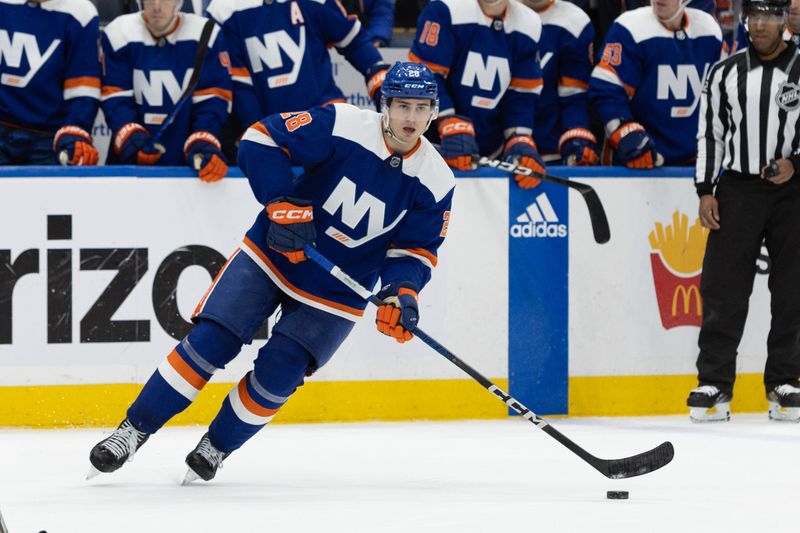 Nov 25, 2023; Elmont, New York, USA; New York Islanders defenseman Alexander Romanov (28) skates with the puck against the Philadelphia Flyers during overtime at UBS Arena. Mandatory Credit: Thomas Salus-USA TODAY Sports