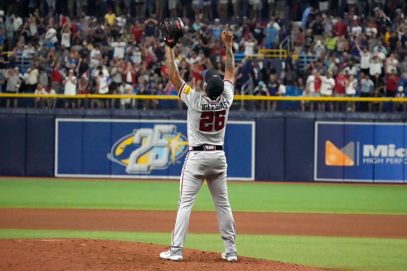 Jul 7, 2023; St. Petersburg, Florida, USA; Atlanta Braves relief pitcher Raisel Iglesias (26) celebrates after the defeating the Tampa Bay Rays at Tropicana Field. Mandatory Credit: Dave Nelson-USA TODAY Sports