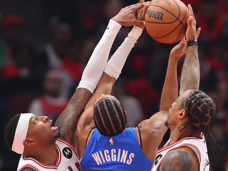 CHICAGO, ILLINOIS - OCTOBER 25: Torrey Craig #13 and DeMar DeRozan #11 of the Chicago Bulls block a shot by Aaron Wiggins #21 of the Oklahoma City Thunder during the second half at the United Center on October 25, 2023 in Chicago, Illinois. NOTE TO USER: User expressly acknowledges and agrees that, by downloading and or using this photograph, User is consenting to the terms and conditions of the Getty Images License Agreement. (Photo by Michael Reaves/Getty Images)