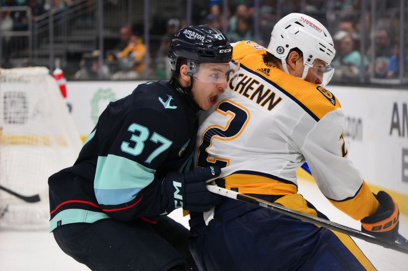 Mar 16, 2024; Seattle, Washington, USA; Seattle Kraken center Yanni Gourde (37) and Nashville Predators defenseman Luke Schenn (2) during the second period at Climate Pledge Arena. Mandatory Credit: Steven Bisig-USA TODAY Sports