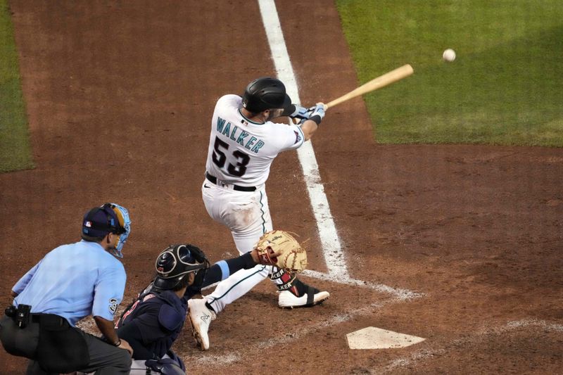 Jun 18, 2023; Phoenix, Arizona, USA; Arizona Diamondbacks first baseman Christian Walker (53) hits a two RBI double against the Cleveland Guardians during the fifth inning at Chase Field. Mandatory Credit: Joe Camporeale-USA TODAY Sports