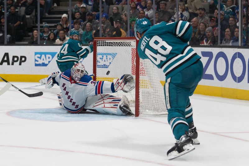 Jan 23, 2024; San Jose, California, USA; San Jose Sharks center Tomas Hertl (48) shoots the puck past New York Rangers goaltender Igor Shesterkin (31) during overtime to win the game at SAP Center at San Jose. Mandatory Credit: Stan Szeto-USA TODAY Sports