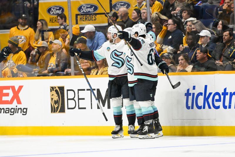 Oct 15, 2024; Nashville, Tennessee, USA; Seattle Kraken right wing Jordan Eberle (7) celebrates his goal with his teammates against the Nashville Predators  during the third period at Bridgestone Arena. Mandatory Credit: Steve Roberts-Imagn Images