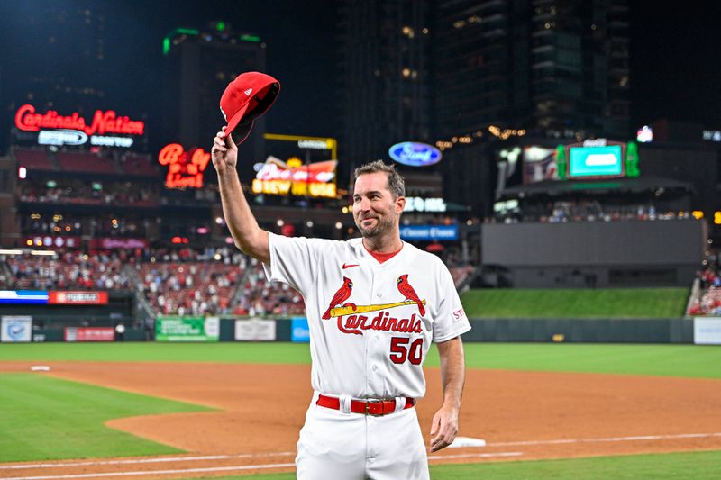 Sep 18, 2023; St. Louis, Missouri, USA;  St. Louis Cardinals starting pitcher Adam Wainwright (50) tips his cap to the fans as he receives a standing ovation after winning his 200th career game in a 1-0 victory over the Milwaukee Brewers at Busch Stadium. Mandatory Credit: Jeff Curry-USA TODAY Sports