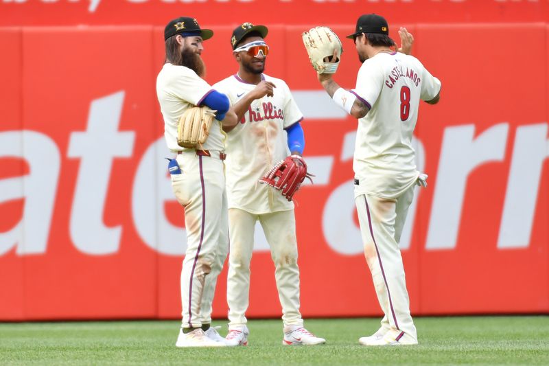 May 19, 2024; Philadelphia, Pennsylvania, USA; Philadelphia Phillies outfielder Brandon Marsh (16),  outfielder Johan Rojas (18) and outfielder Nick Castellanos (8) celebrate win against the Washington Nationals at Citizens Bank Park. Mandatory Credit: Eric Hartline-USA TODAY Sports