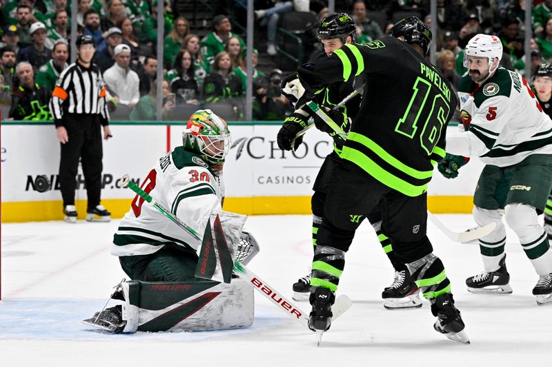 Jan 10, 2024; Dallas, Texas, USA; Minnesota Wild goaltender Jesper Wallstedt (30) and Dallas Stars center Joe Pavelski (16) look for the puck in the Wild zone during the second period at the American Airlines Center. Mandatory Credit: Jerome Miron-USA TODAY Sports