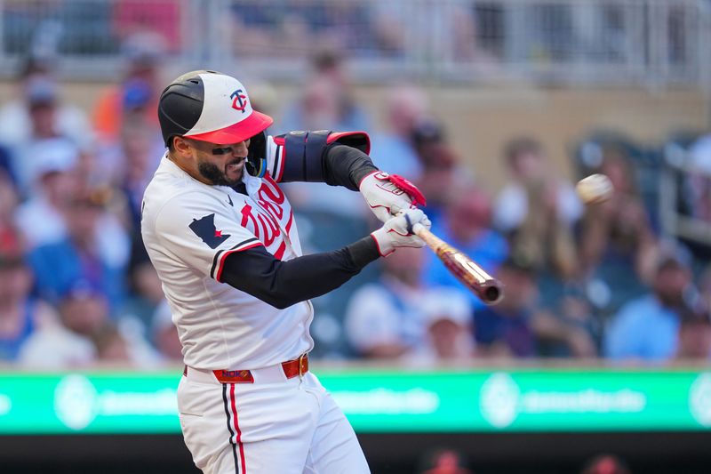 May 6, 2025; Minneapolis, Minnesota, USA; Minnesota Twins shortstop Carlos Correa (4) hits a home run against the Baltimore Orioles in the third inning at Target Field. Mandatory Credit: Brad Rempel-Imagn Images