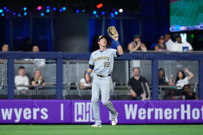 May 22, 2024; Miami, Florida, USA; Milwaukee Brewers outfielder Christian Yelich (22) catches a fly ball against the Miami Marlins during the second inning at loanDepot Park. Mandatory Credit: Rich Storry-USA TODAY Sports