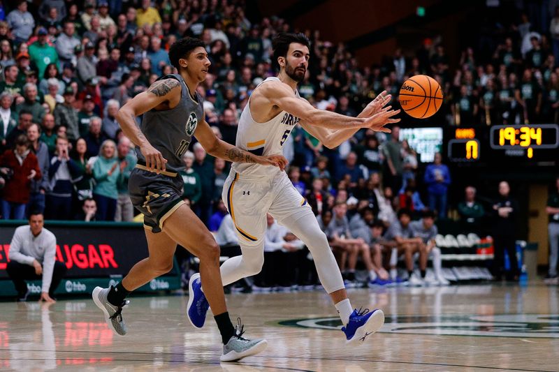 Feb 9, 2024; Fort Collins, Colorado, USA; San Jose State Spartans forward Tibet Gorener (5) passes the ball as Colorado State Rams guard Nique Clifford (10) guards in the first half at Moby Arena. Mandatory Credit: Isaiah J. Downing-USA TODAY Sports