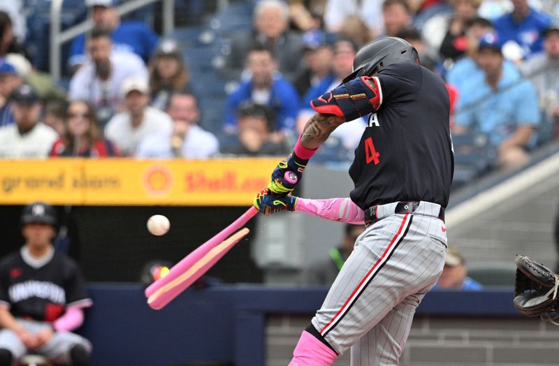 May 12, 2024; Toronto, Ontario, CAN;  Minnesota Twins shortstop Carlos Correa (4) breaks his bat as he he hits an infield fly out against the Toronto Blue Jays in the first inning at Rogers Centre. Mandatory Credit: Dan Hamilton-USA TODAY Sports