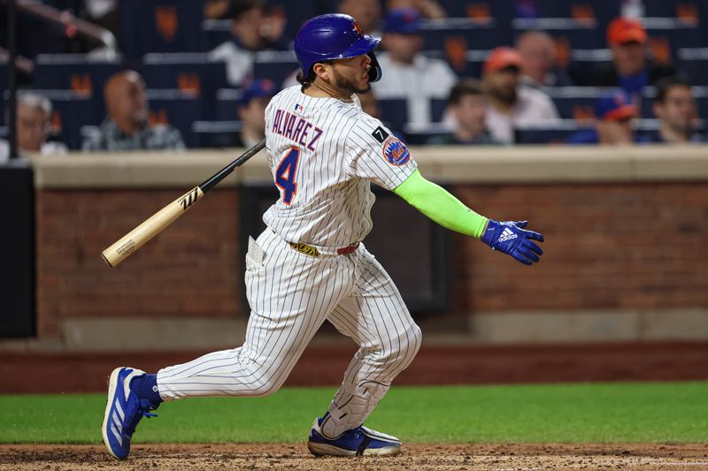 May 27, 2025; New York City, New York, USA; New York Mets catcher Francisco Alvarez (4) singles during the eighth inning against the Chicago White Sox at Citi Field. Mandatory Credit: Vincent Carchietta-Imagn Images