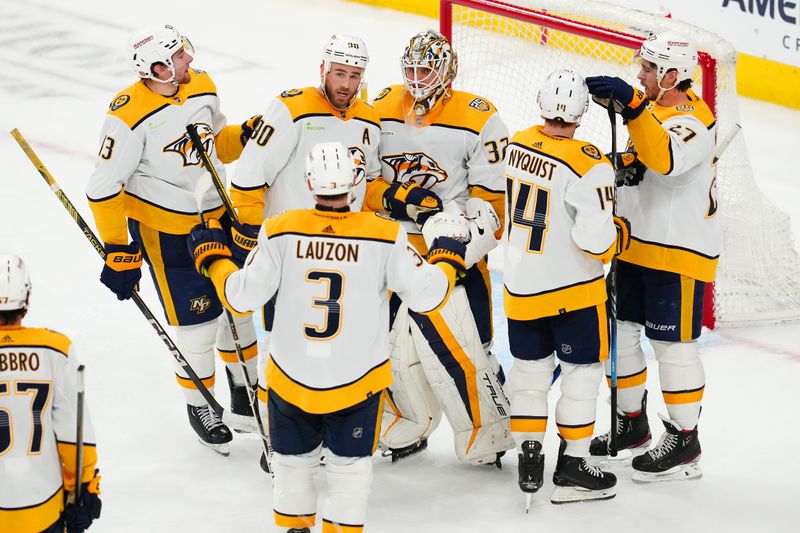 Feb 20, 2024; Las Vegas, Nevada, USA; Nashville Predators players celebrate after defeating the Vegas Golden Knights 5-3 at T-Mobile Arena. Mandatory Credit: Stephen R. Sylvanie-USA TODAY Sports