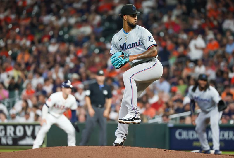 Jul 11, 2024; Houston, Texas, USA; Miami Marlins starting pitcher Roddery Munoz (71) pitches against the Houston Astros as third baseman Alex Bregman (2) leads off first base in the first inning at Minute Maid Park. Mandatory Credit: Thomas Shea-USA TODAY Sports