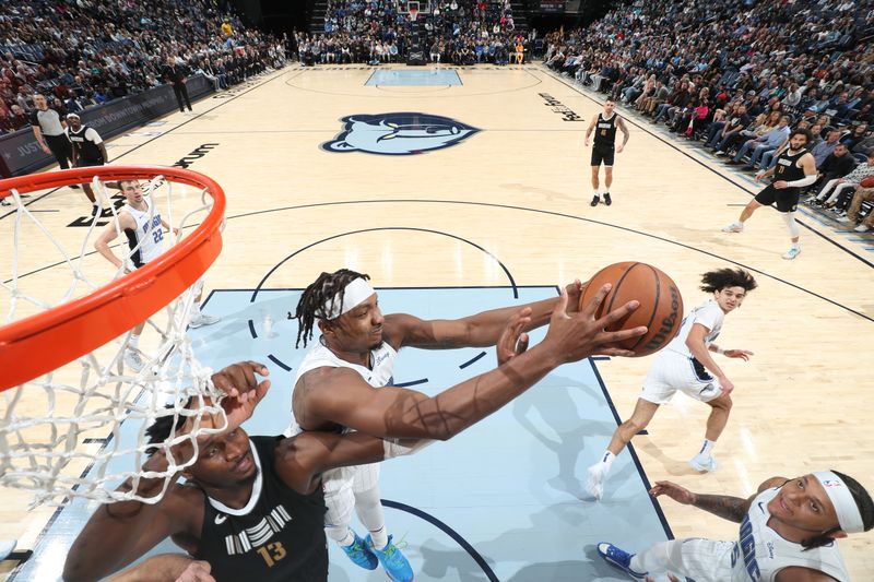 MEMPHIS, TN - JANUARY 26:  Wendell Carter Jr. #34 of the Orlando Magic and Jaren Jackson Jr. #13 of the Memphis Grizzlies =battle for a rebound on January 26, 2024 at FedExForum in Memphis, Tennessee. NOTE TO USER: User expressly acknowledges and agrees that, by downloading and or using this photograph, User is consenting to the terms and conditions of the Getty Images License Agreement. Mandatory Copyright Notice: Copyright 2024 NBAE (Photo by Joe Murphy/NBAE via Getty Images)