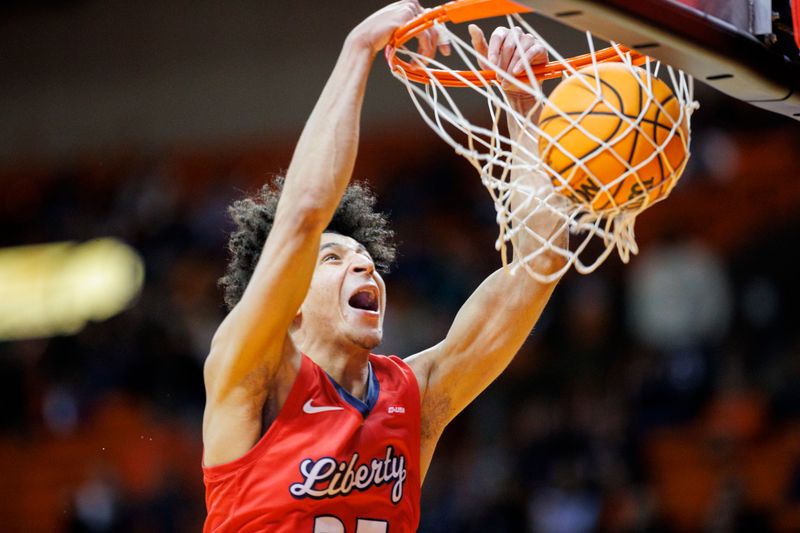 Feb 3, 2024; El Paso, Texas, USA; Liberty University Flames guard Joseph Venzant (23) dunks the ball against the UTEP Miners in the first half at Don Haskins Center. Mandatory Credit: Ivan Pierre Aguirre-USA TODAY Sports