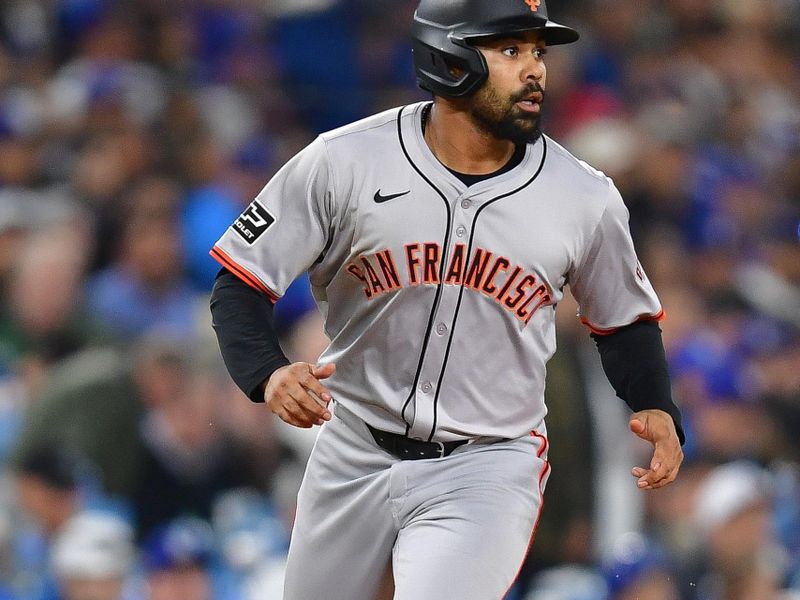 Apr 3, 2024; Los Angeles, California, USA; San Francisco Giants first baseman LaMonte Wade Jr. (31) reaches third against the Los Angeles Dodgers during the sixth inning at Dodger Stadium. Mandatory Credit: Gary A. Vasquez-USA TODAY Sports