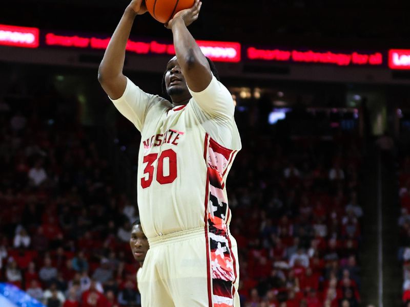 Feb 4, 2023; Raleigh, North Carolina, USA; North Carolina State Wolfpack forward D.J. Burns Jr. (30) shoots the ball during the first half against Georgia Tech Yellow Jackets at PNC Arena. Mandatory Credit: Jaylynn Nash-USA TODAY Sports