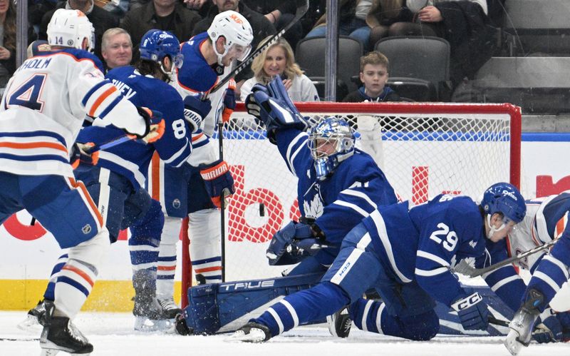 Nov 16, 2024; Toronto, Ontario, CAN; A shot from Edmonton Oilers forward Leon Draisatl (not shown) beats Toronto Maple Leafs goalie Anthony Stolarz (41) for a goal in the third period at Scotiabank Arena. Mandatory Credit: Dan Hamilton-Imagn Images