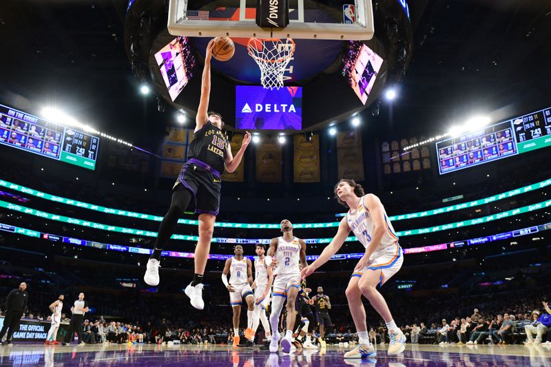 LOS ANGELES, CA - JANUARY 15: Austin Reaves #15 of the Los Angeles Lakers drives to the basket during the game against the Oklahoma City Thunder on January 15, 2024 at Crypto.Com Arena in Los Angeles, California. NOTE TO USER: User expressly acknowledges and agrees that, by downloading and/or using this Photograph, user is consenting to the terms and conditions of the Getty Images License Agreement. Mandatory Copyright Notice: Copyright 2024 NBAE (Photo by Adam Pantozzi/NBAE via Getty Images)