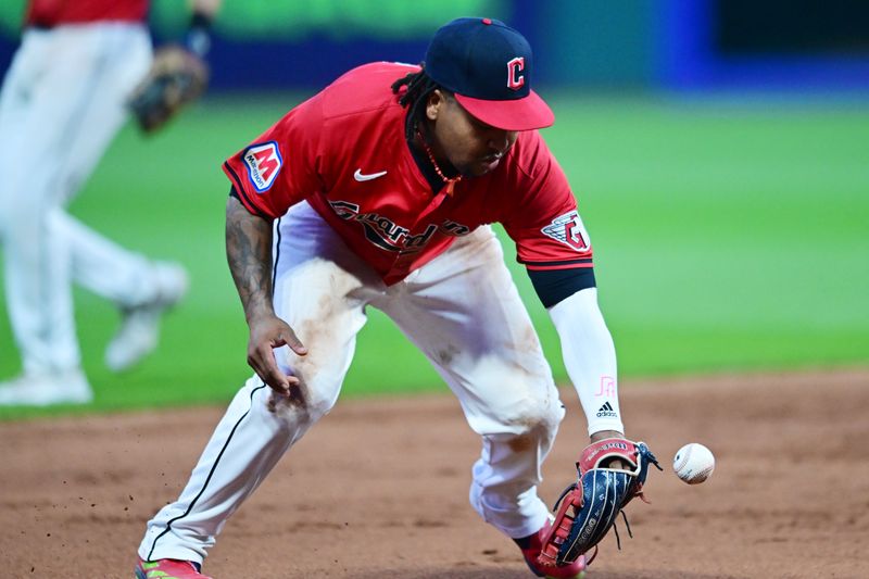 Jun 19, 2024; Cleveland, Ohio, USA; Cleveland Guardians third baseman Jose Ramirez (11) fields a ball hit by Seattle Mariners center fielder Victor Robles (10) during the ninth inning at Progressive Field. Mandatory Credit: Ken Blaze-USA TODAY Sports