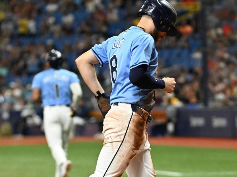 Jul 28, 2024; St. Petersburg, Florida, USA; Tampa Bay Rays second baseman Brandon Lowe (8) scores the winning run on a walk in the eighth inning against the Cincinnati Reds at Tropicana Field. Mandatory Credit: Jonathan Dyer-USA TODAY Sports