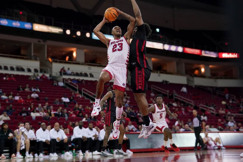 Feb 14, 2024; Fresno, California, USA; Fresno State Bulldogs guard Leo Colimerio (23) shoots the ball next to UNLV Rebels forward Rob Whaley Jr. (5) in the second half at the Save Mart Center. Mandatory Credit: Cary Edmondson-USA TODAY Sports