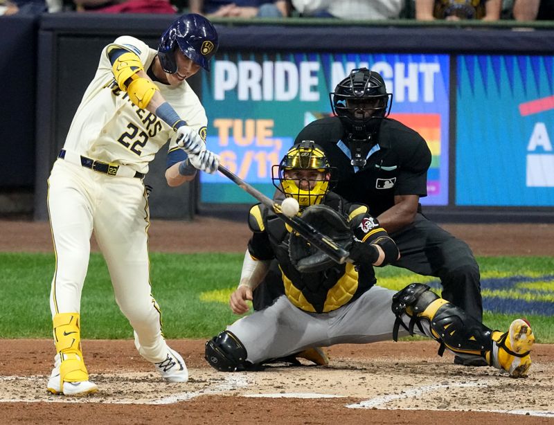 May 13, 2024; Milwaukee, Wisconsin, USA;  Milwaukee Brewers outfielder Christian Yelich (22) hits a single during the third inning of their game against the Pittsburgh Pirates at American Family Field. Mandatory Credit: Mark Hoffman-USA TODAY Sports