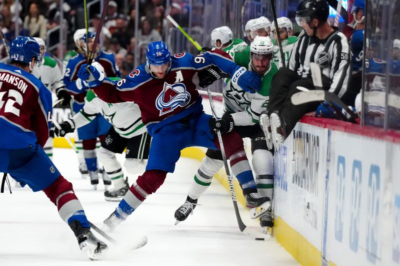 May 17, 2024; Denver, Colorado, USA; Colorado Avalanche right wing Mikko Rantanen (96) checks Dallas Stars left wing Mason Marchment (27) in the third period in game six of the second round of the 2024 Stanley Cup Playoffs at Ball Arena. Mandatory Credit: Ron Chenoy-USA TODAY Sports