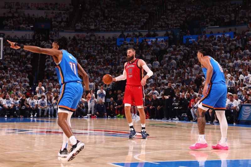 OKLAHOMA CITY, OK - APRIL 24: Jonas Valanciunas #17 of the New Orleans Pelicans dribbles the ball during the game against the Oklahoma City Thunder during Round 1 Game 2 of the 2024 NBA Playoffs on April 24, 2024 at Paycom Arena in Oklahoma City, Oklahoma. NOTE TO USER: User expressly acknowledges and agrees that, by downloading and or using this photograph, User is consenting to the terms and conditions of the Getty Images License Agreement. Mandatory Copyright Notice: Copyright 2024 NBAE (Photo by Zach Beeker/NBAE via Getty Images)