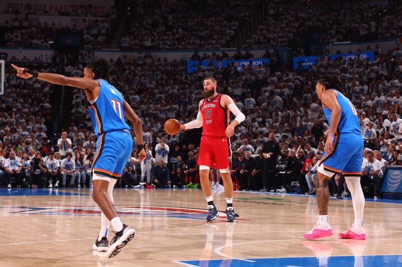 OKLAHOMA CITY, OK - APRIL 24: Jonas Valanciunas #17 of the New Orleans Pelicans dribbles the ball during the game against the Oklahoma City Thunder during Round 1 Game 2 of the 2024 NBA Playoffs on April 24, 2024 at Paycom Arena in Oklahoma City, Oklahoma. NOTE TO USER: User expressly acknowledges and agrees that, by downloading and or using this photograph, User is consenting to the terms and conditions of the Getty Images License Agreement. Mandatory Copyright Notice: Copyright 2024 NBAE (Photo by Zach Beeker/NBAE via Getty Images)