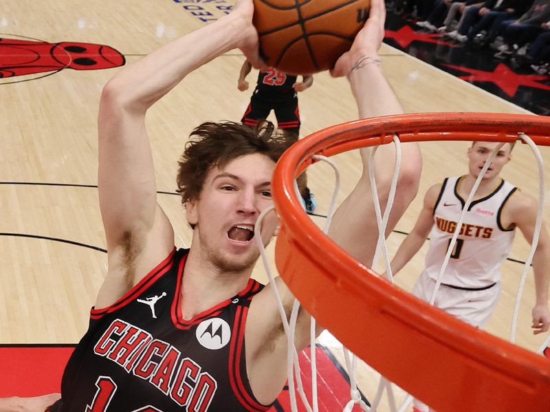 CHICAGO, ILLINOIS - JANUARY 27: Matas Buzelis #14 of the Chicago Bulls goes up for a dunk against the Denver Nuggets during the second half at the United Center on January 27, 2025 in Chicago, Illinois. NOTE TO USER: User expressly acknowledges and agrees that, by downloading and or using this photograph, User is consenting to the terms and conditions of the Getty Images License Agreement.  (Photo by Michael Reaves/Getty Images)