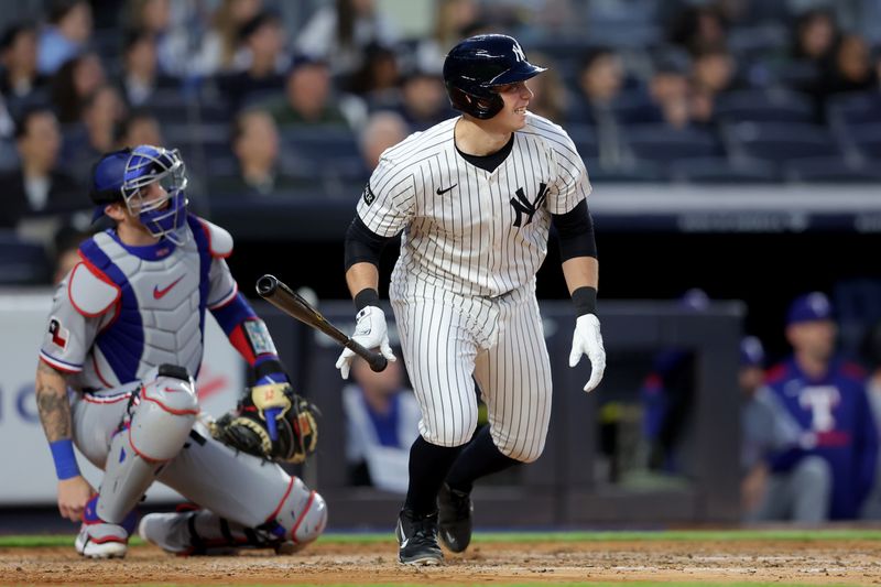 May 20, 2025; Bronx, New York, USA; New York Yankees designated hitter Ben Rice (22) watches his sacrifice fly against the Texas Rangers during the fourth inning at Yankee Stadium. Mandatory Credit: Brad Penner-Imagn Images