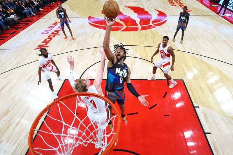 TORONTO, CANADA - MARCH 25: Trendon Watford #9 of the Brooklyn Nets shoots the ball during the game against the Toronto Raptors on March 25, 2024 at the Scotiabank Arena in Toronto, Ontario, Canada.  NOTE TO USER: User expressly acknowledges and agrees that, by downloading and or using this Photograph, user is consenting to the terms and conditions of the Getty Images License Agreement.  Mandatory Copyright Notice: Copyright 2024 NBAE (Photo by Vaughn Ridley/NBAE via Getty Images)