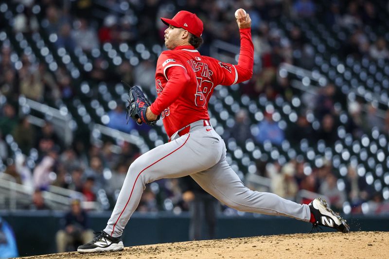 Apr 25, 2025; Minneapolis, Minnesota, USA; Los Angeles Angels relief pitcher Victor Mederos (58) delivers a pitch against the Minnesota Twins during the sixth inning at Target Field. Mandatory Credit: Matt Krohn-Imagn Images