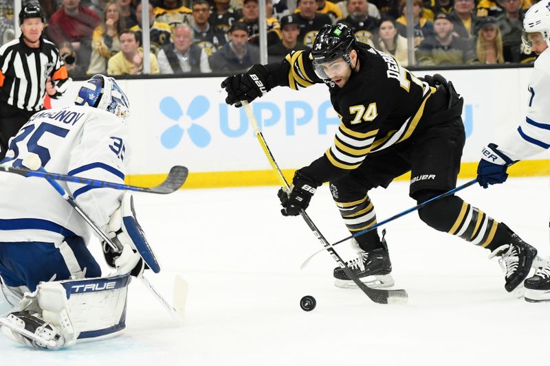 May 4, 2024; Boston, Massachusetts, USA; Boston Bruins left wing Jake DeBrusk (74) shoots the puck towards Toronto Maple Leafs goaltender Ilya Samsonov (35) during the first period in game seven of the first round of the 2024 Stanley Cup Playoffs at TD Garden. Mandatory Credit: Bob DeChiara-USA TODAY Sports