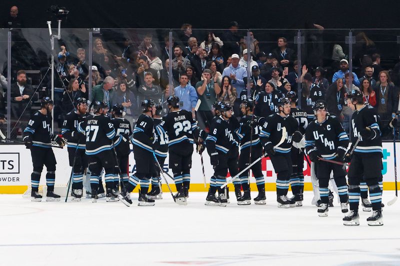 Feb 25, 2025; Salt Lake City, Utah, USA; The Utah Hockey Club celebrate a win over the Chicago Blackhawks at Delta Center. Mandatory Credit: Rob Gray-Imagn Images