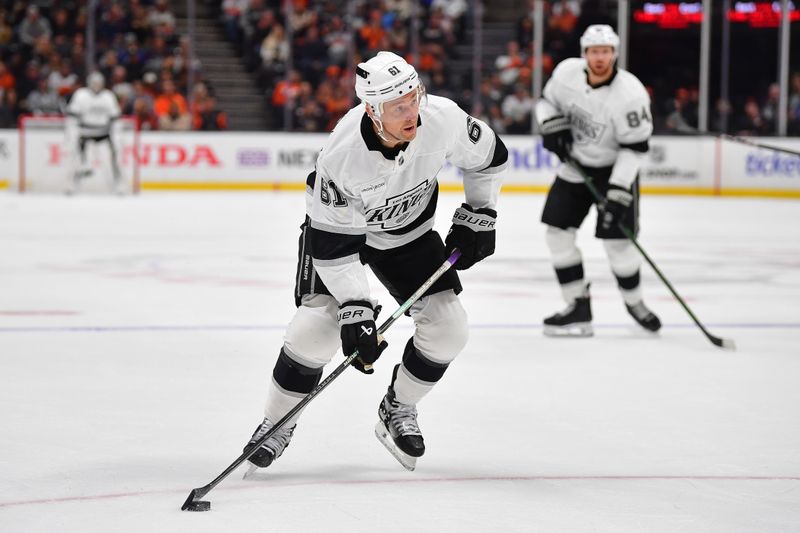 Nov 29, 2024; Anaheim, California, USA; Los Angeles Kings center Trevor Lewis (61) moves in for a shot against the Anaheim Ducks during the first period at Honda Center. Mandatory Credit: Gary A. Vasquez-Imagn Images